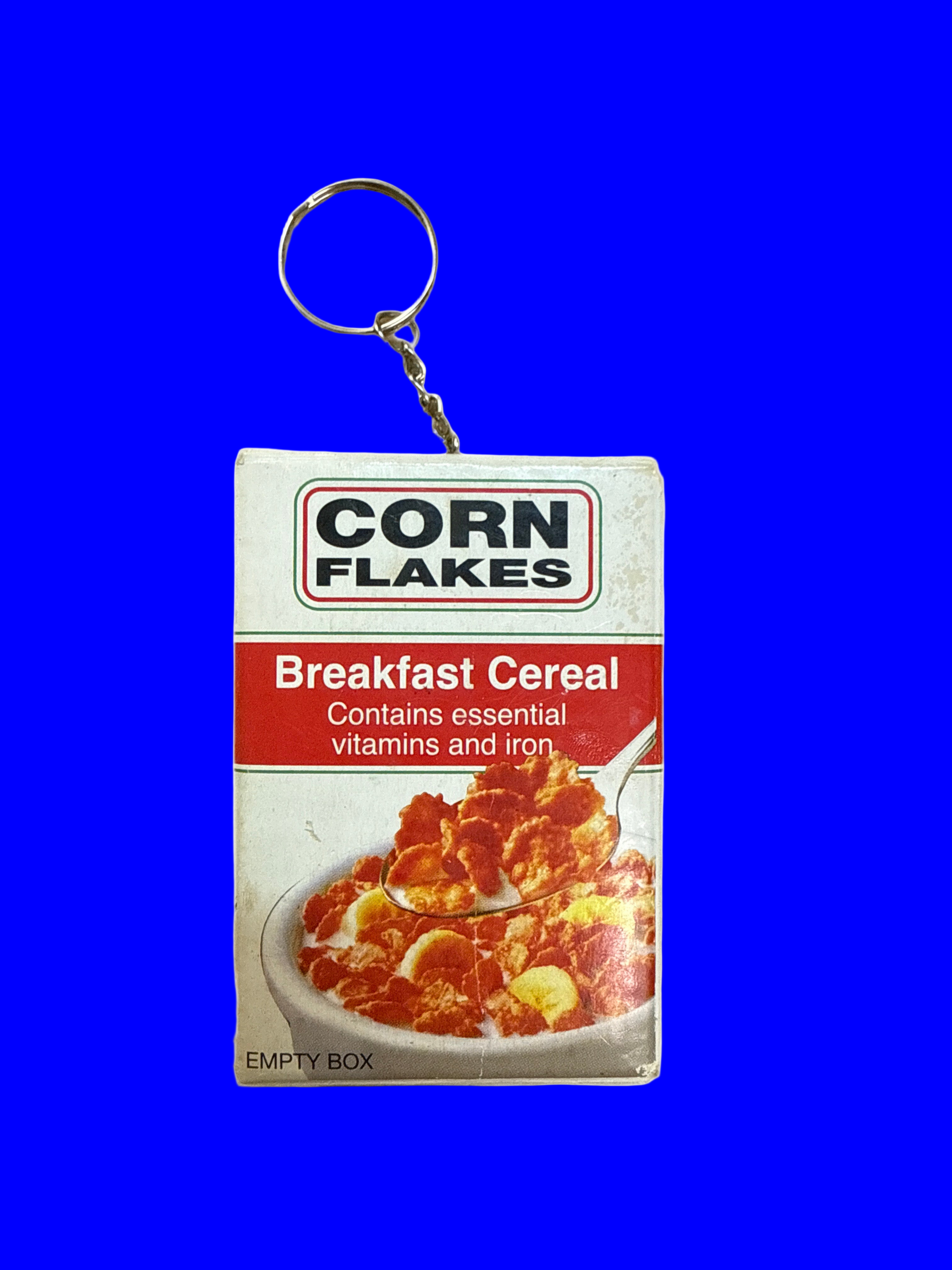 Corn Flakes breakfast cereal keychain with packaging design.