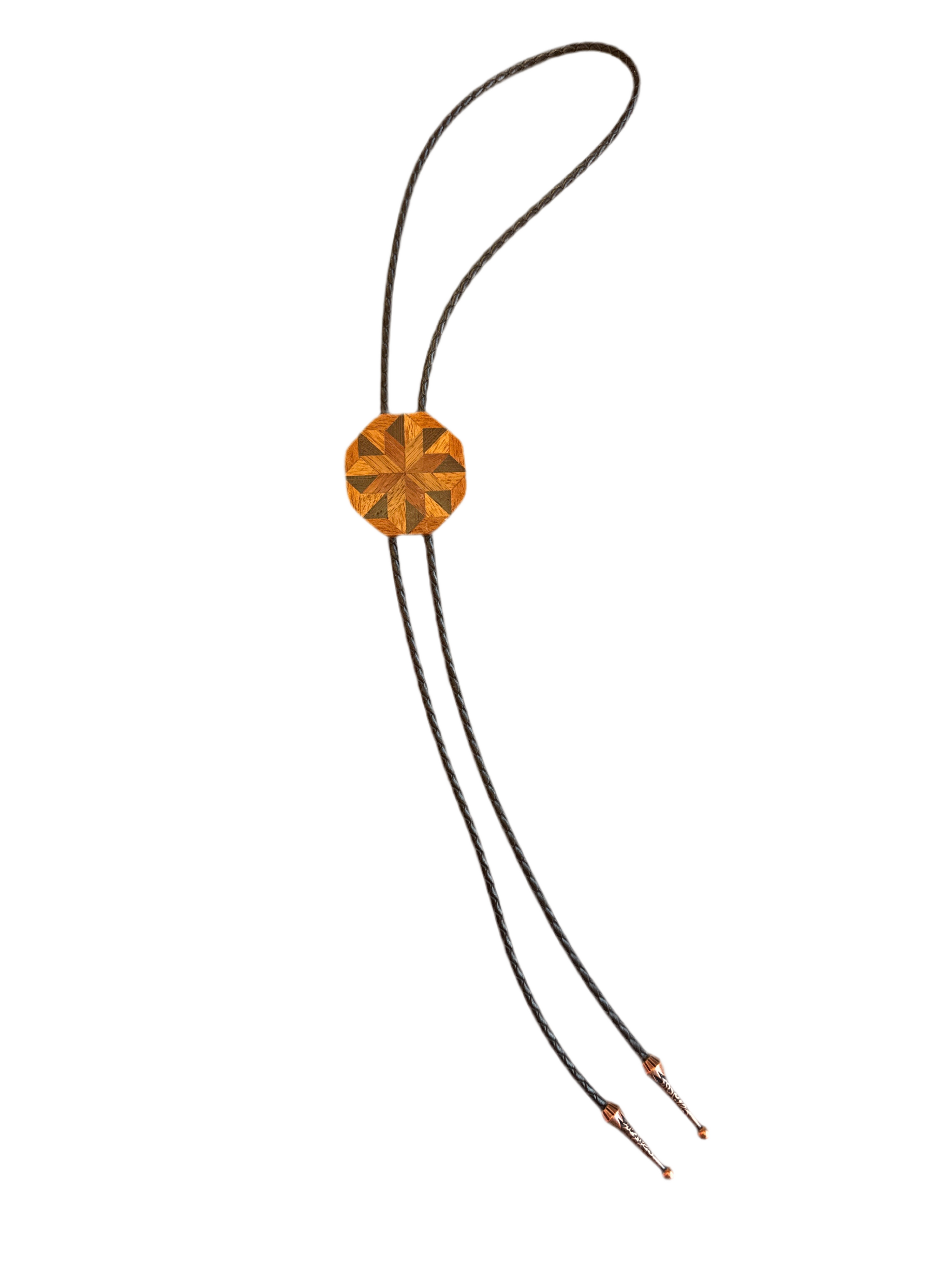 Bolo tie with a decorative wooden bead on a white background