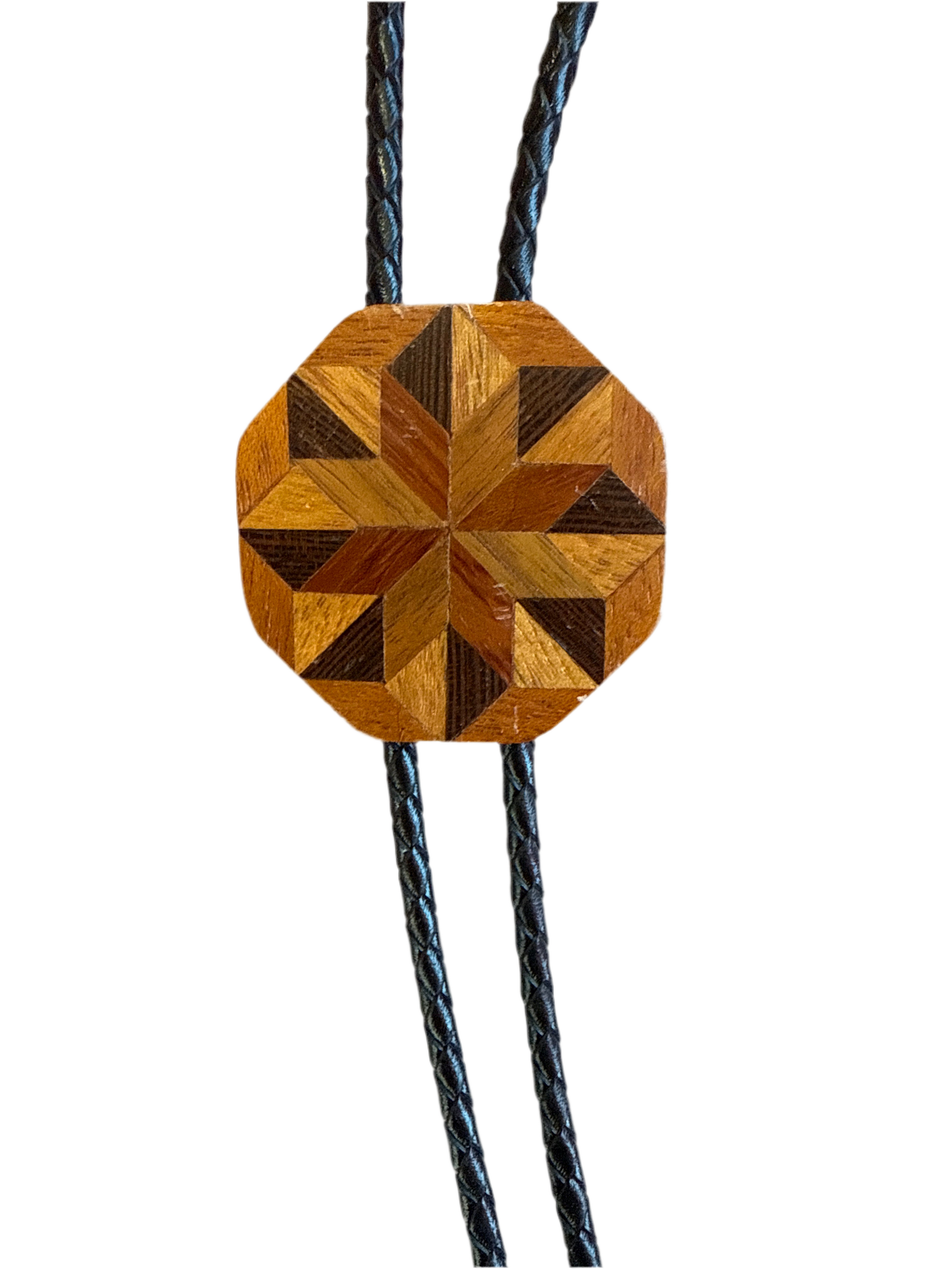 Wooden bolo tie with geometric pattern on a white background