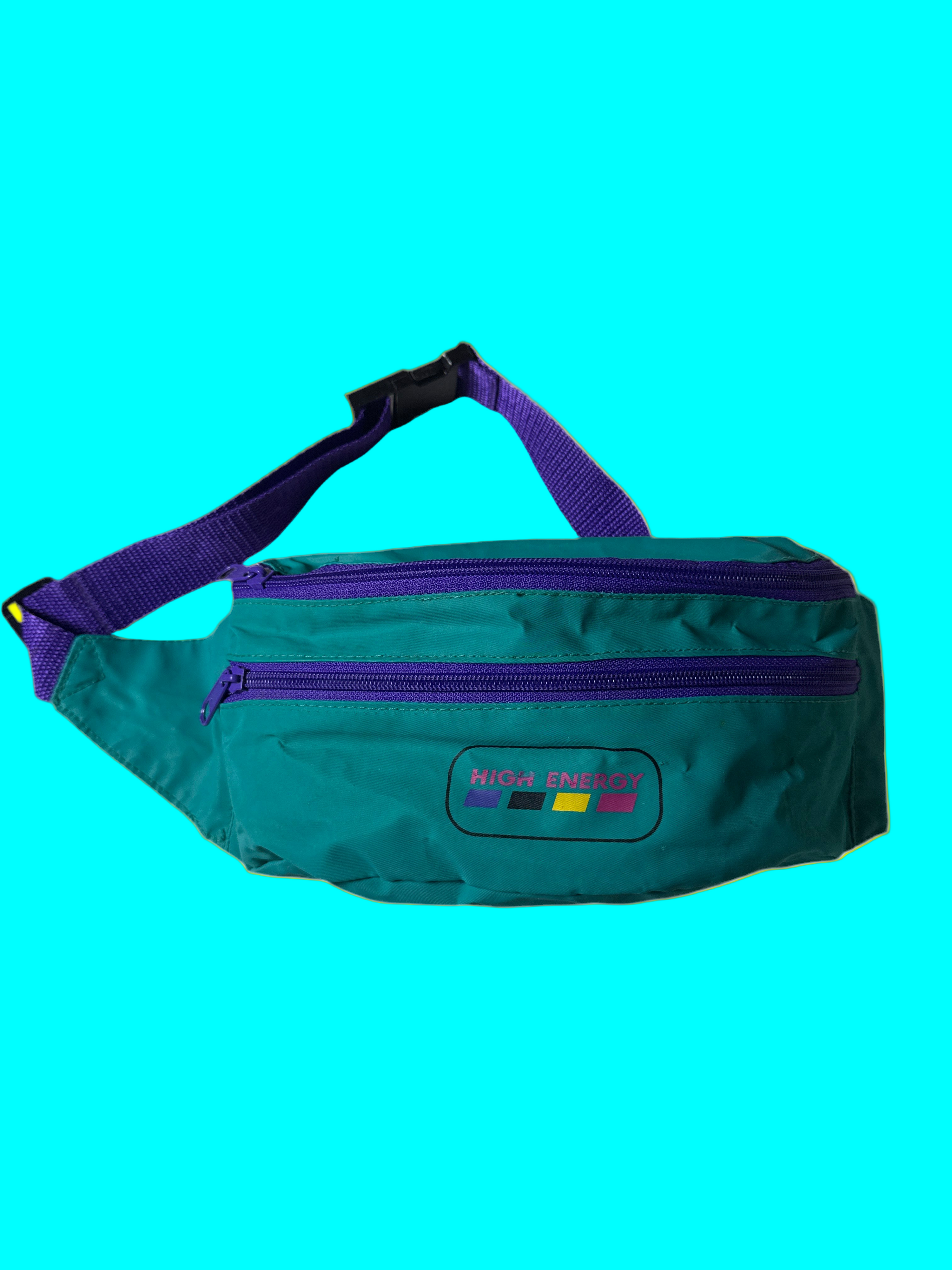 Teal fanny pack with purple strap on a white background