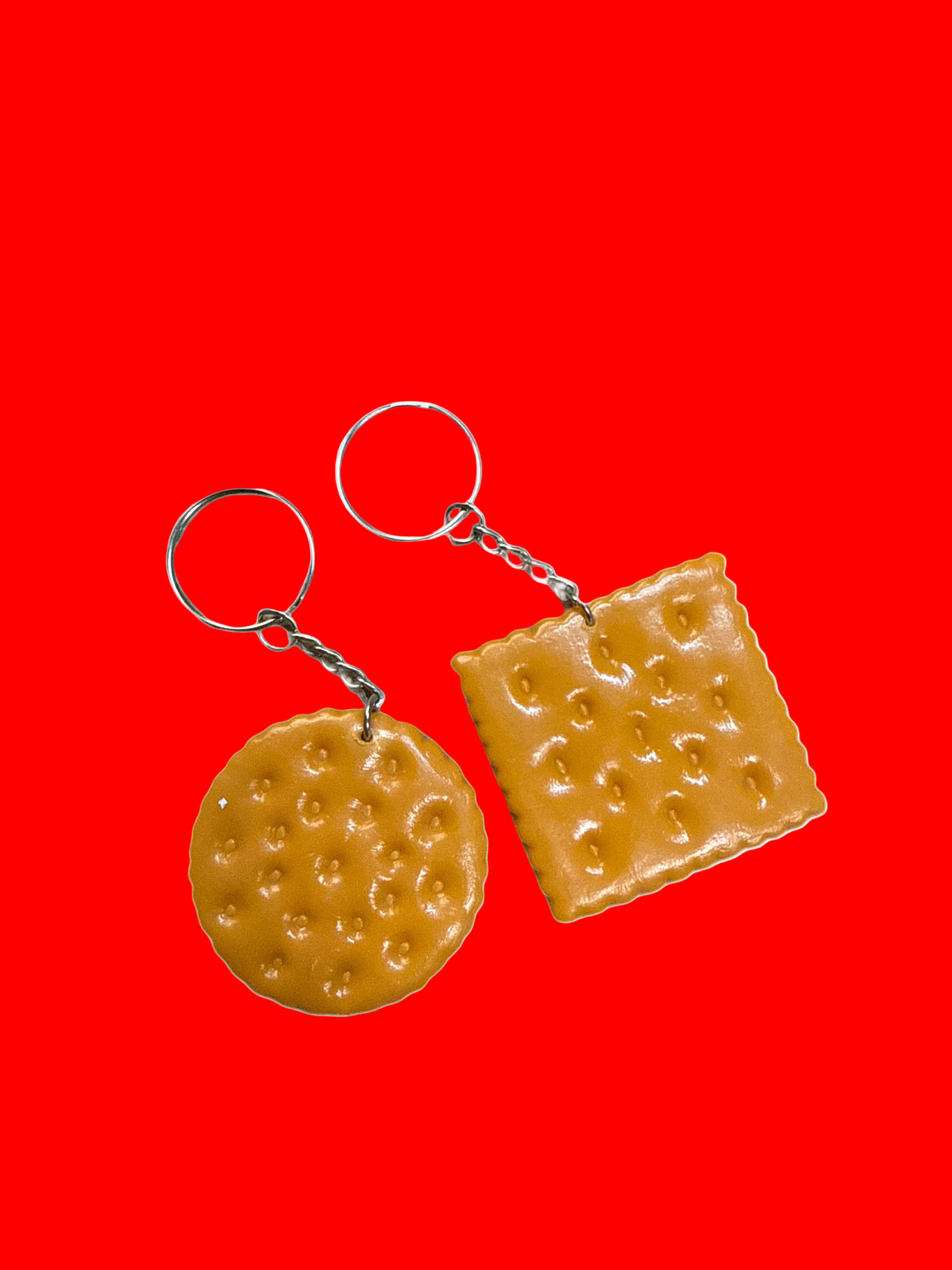 Two cracker-shaped keychains on a white background