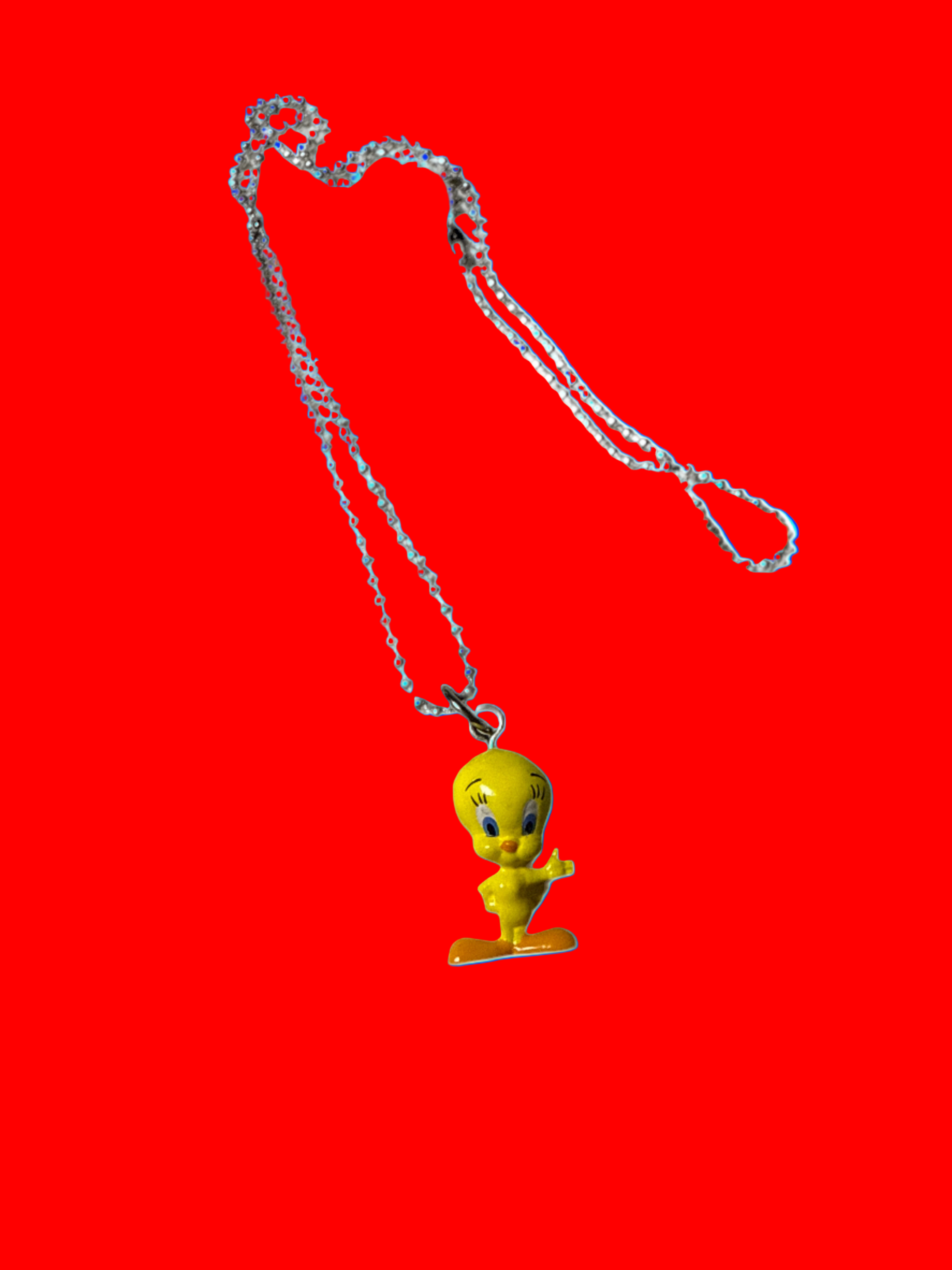 Necklace with a tweedy bird pendant on a  background